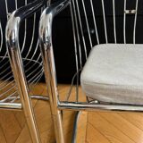 6 chrome metal chairs in the style of Gastonne Ronaldo.