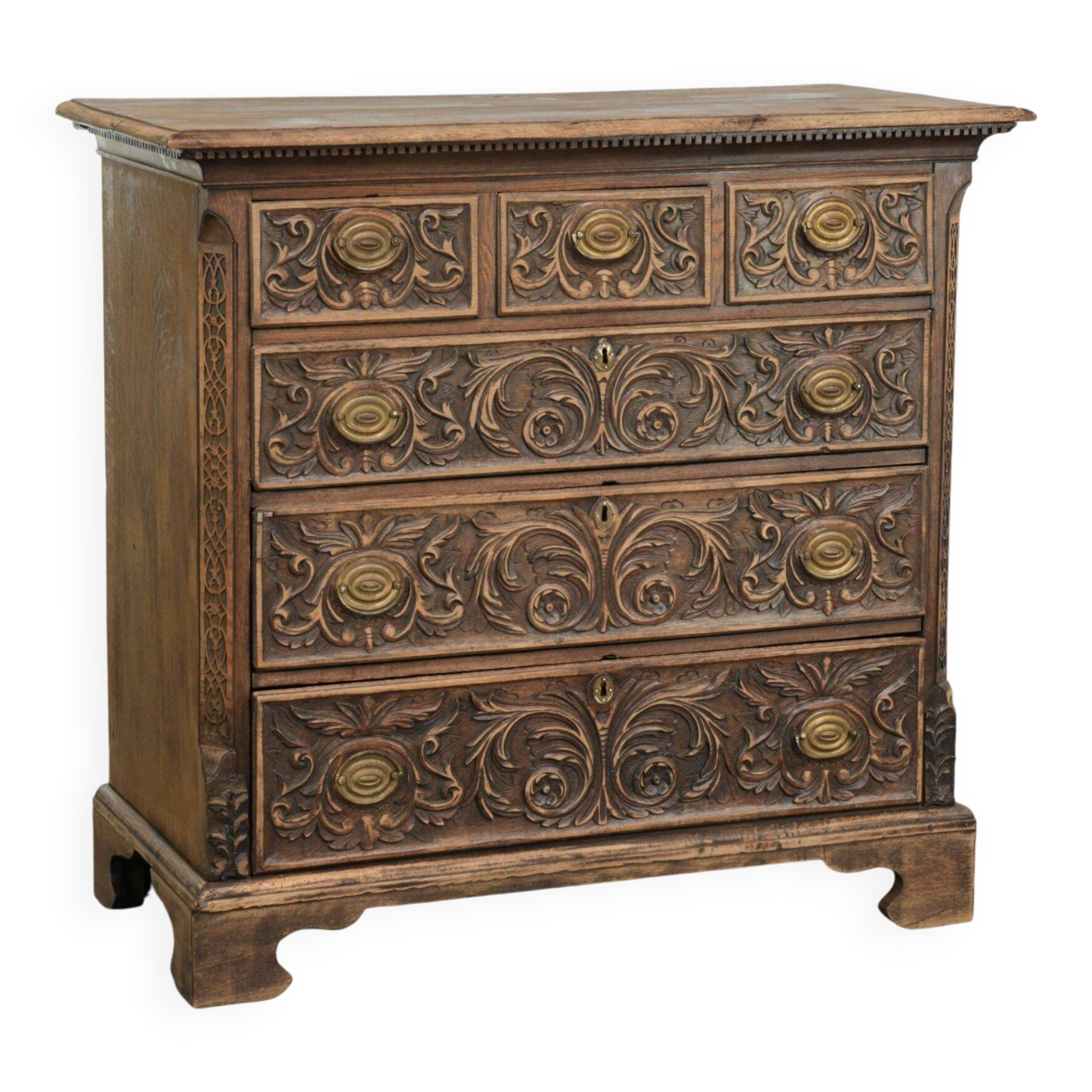 Richly carved English oak chest of drawers from the 18th century