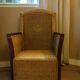 comfortable colonial-style armchair in rattan and mahogany