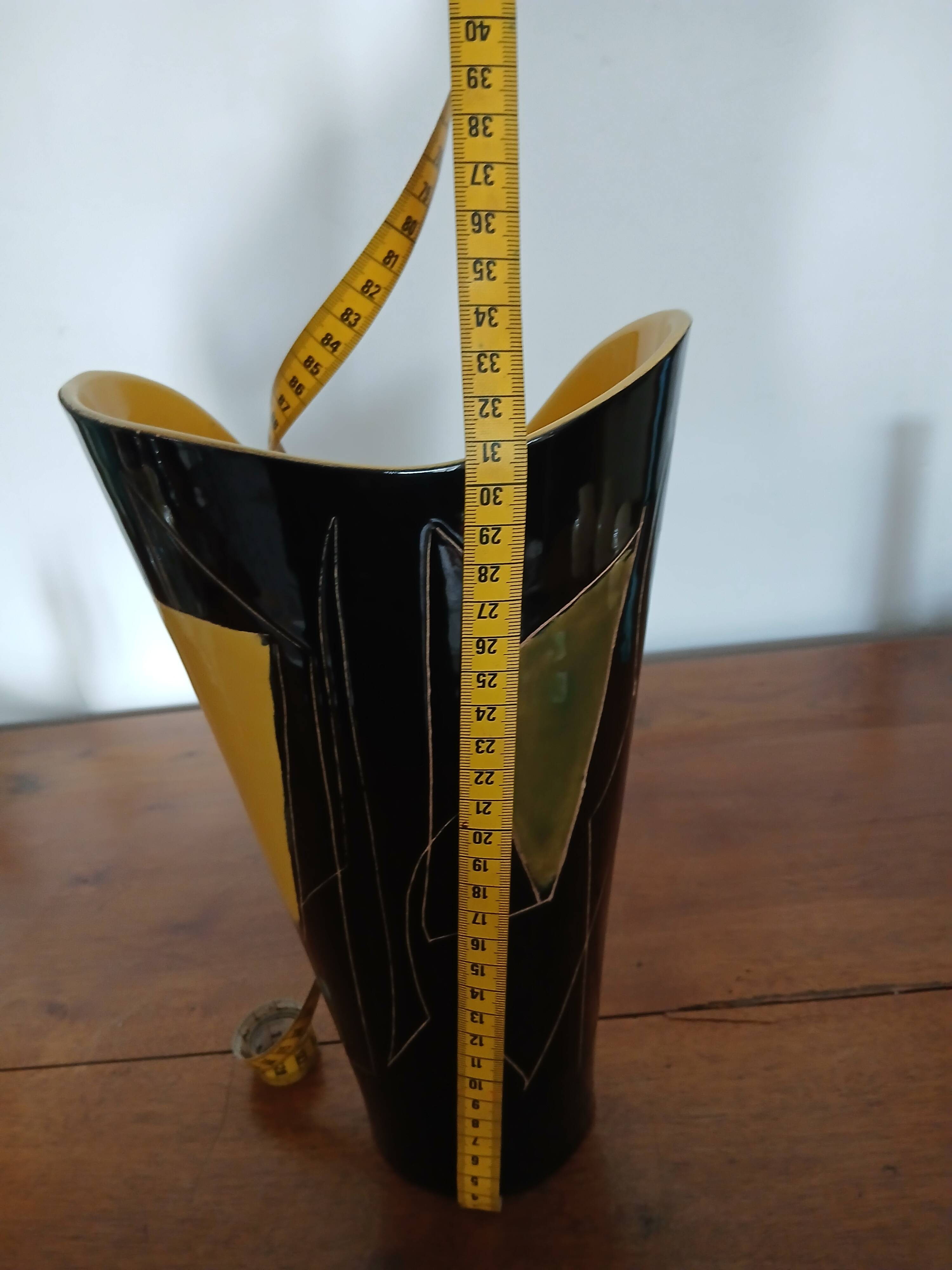 Yellow and black ceramic vase