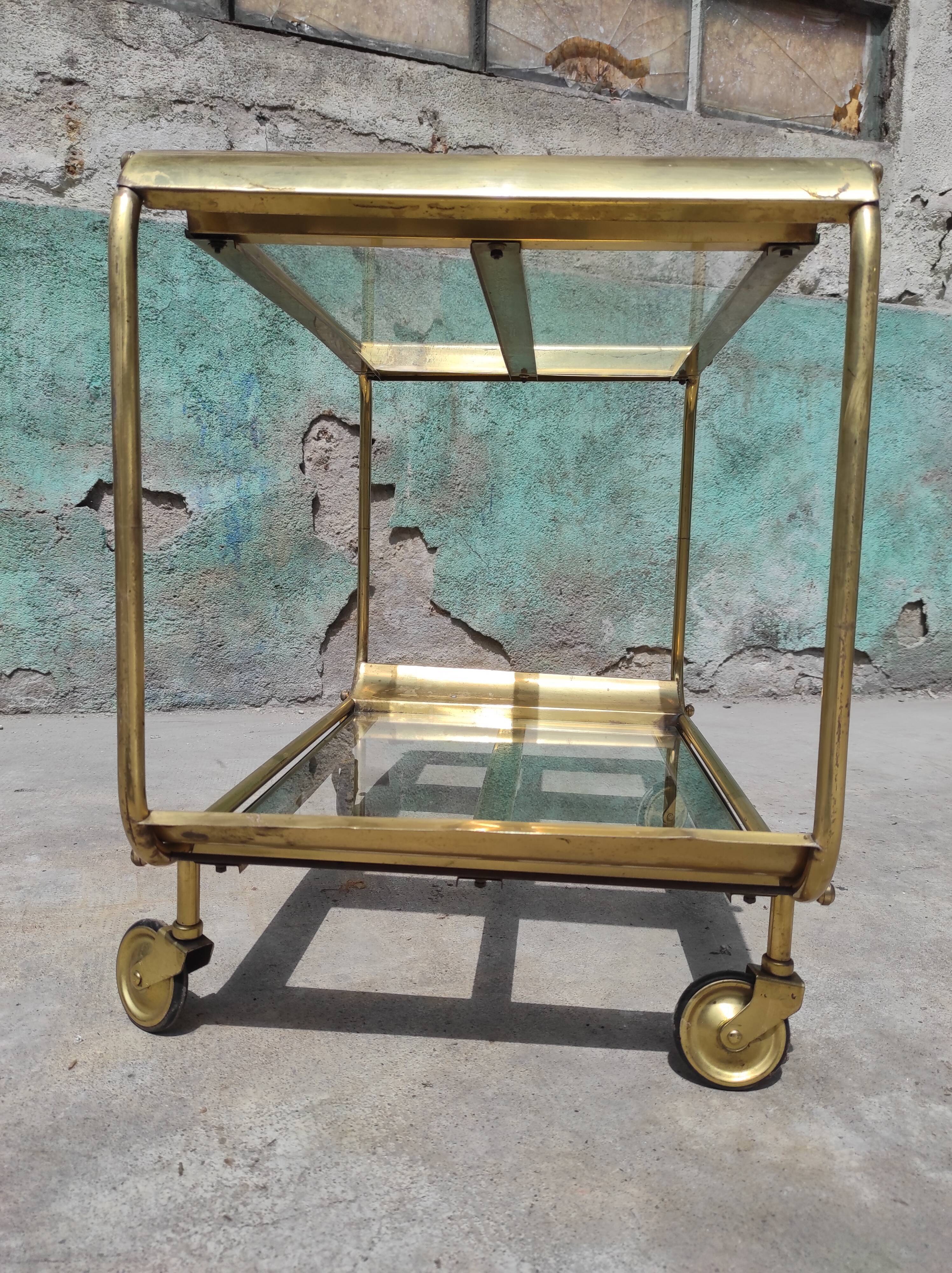 Old rolling coffee table serving vintage brass bar 50s mid-century design