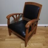 Colonial armchair in teak and black leather