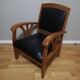 Fauteuil colonial en teck et cuir noir