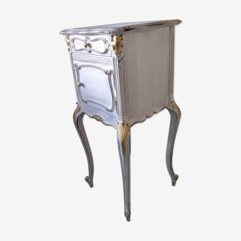 White and gold patinated bedside table