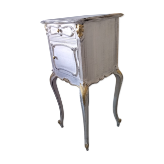 White and gold patinated bedside table
