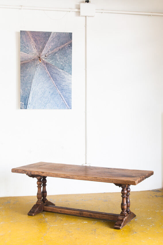 Old coffee table in solid oak wood. France, early twentieth century.