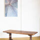Old coffee table in solid oak wood. France, early twentieth century.