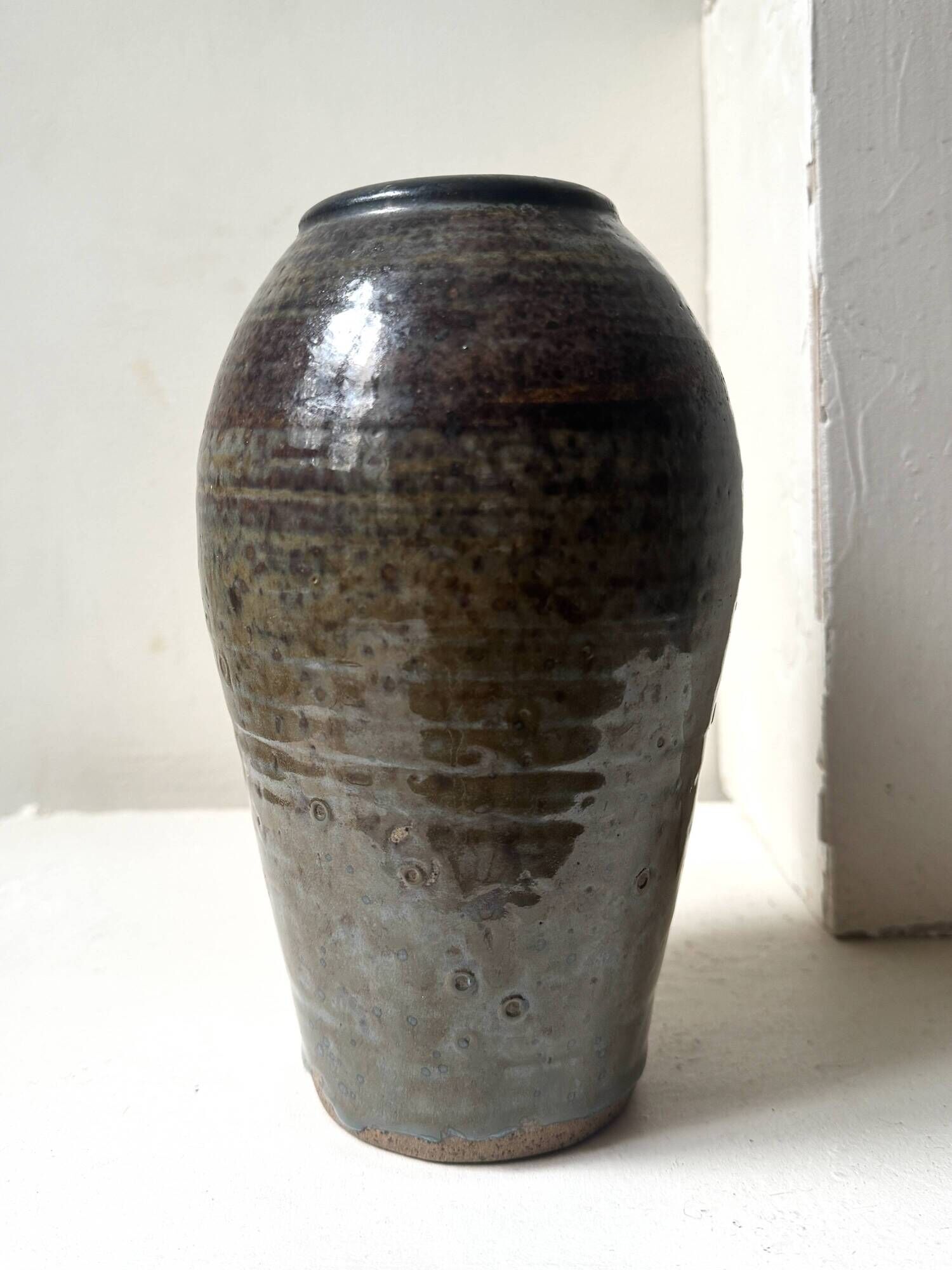 Brown-black glazed stoneware vase, signed underneath the base, circa 1950.