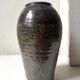Brown-black glazed stoneware vase, signed underneath the base, circa 1950.