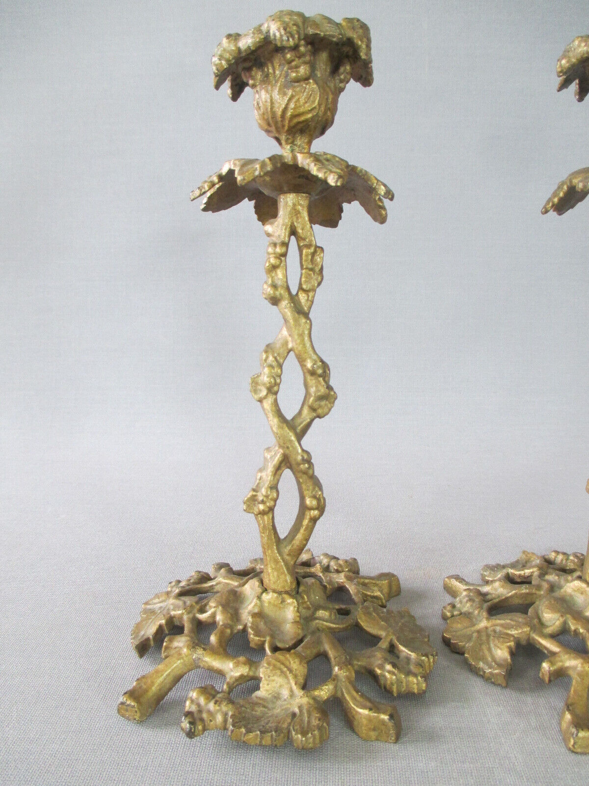 Pair of gilded bronze candlesticks with vine décor