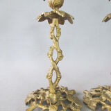 Pair of gilded bronze candlesticks with vine décor