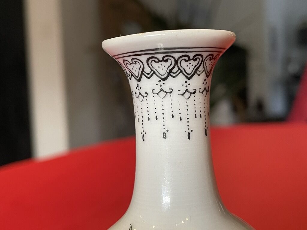 Porcelain vase decorated with flowers and birds