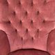 Fauteuil crapaud rose capitonné