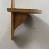 Small wall-mounted wooden shelf