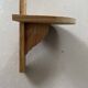 Small wall-mounted wooden shelf