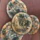 Four antique dessert plates in majolica with vine decoration.