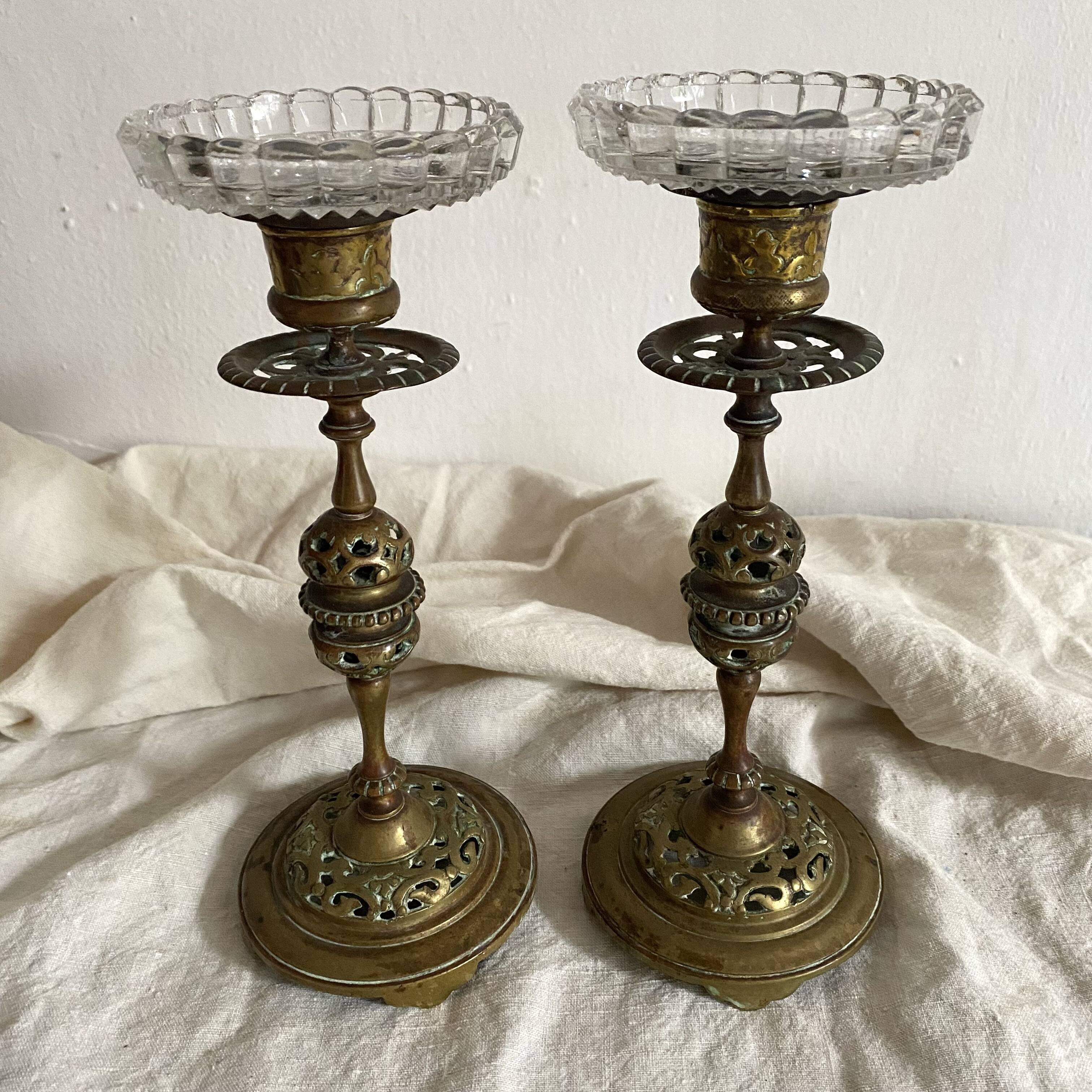 Pair of openwork brass candlesticks and glass bobeches