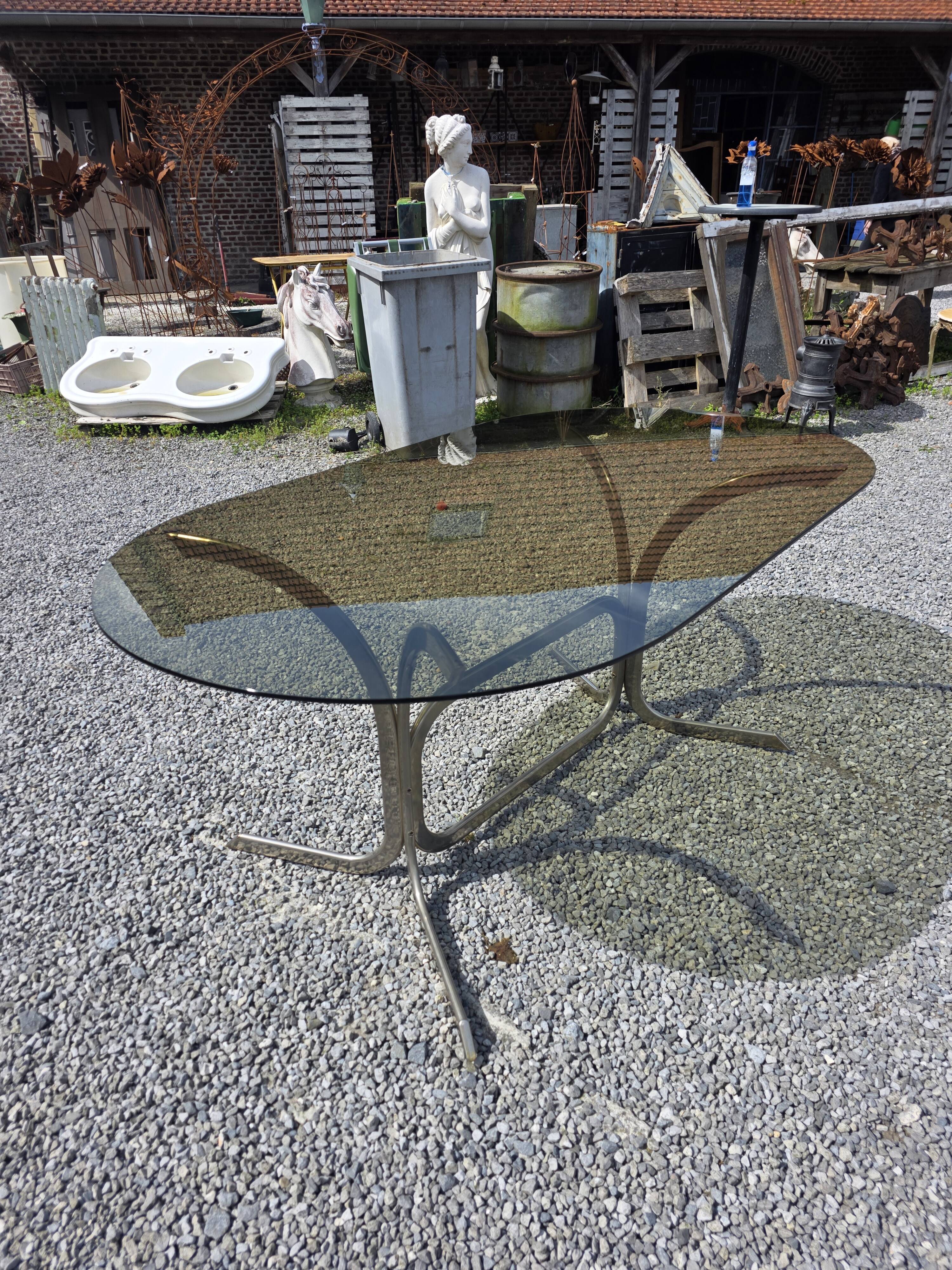 Silver metal table with smoked glass top from the 1970s.