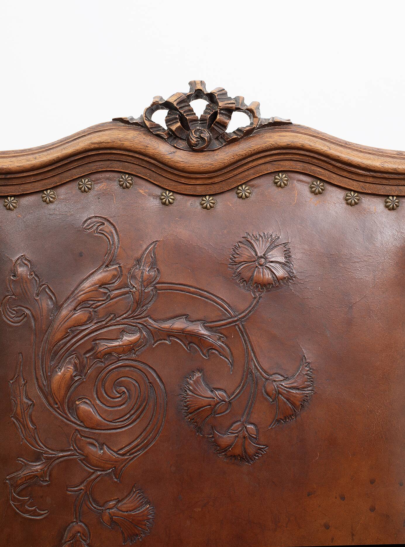 Set of 4 Louis XVI style chairs in carved wood and embossed leather.