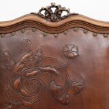 Set of 4 Louis XVI style chairs in carved wood and embossed leather.