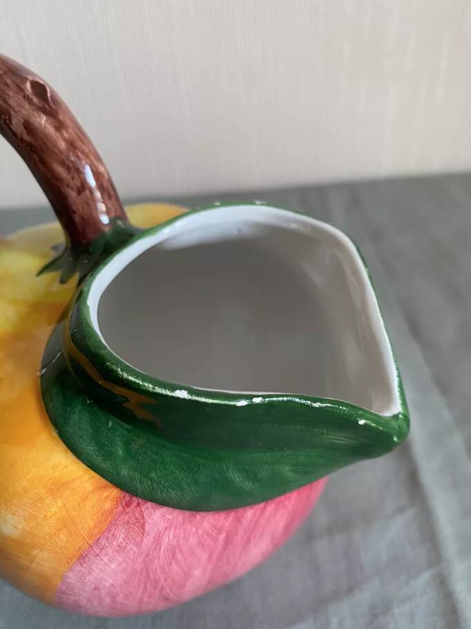 Earthenware pitcher evoking a fruit