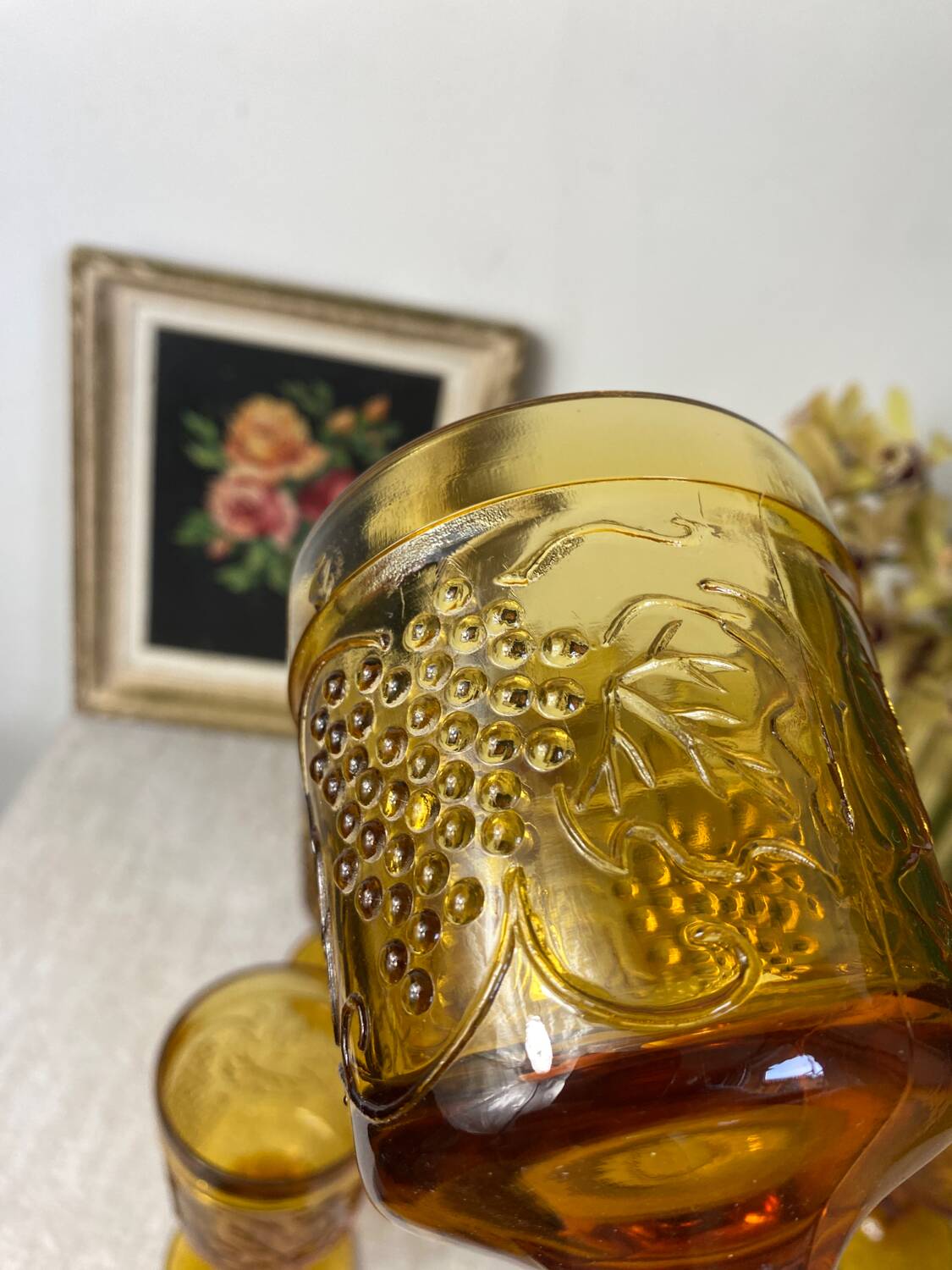 Six amber-colored stemmed glasses