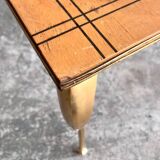 Vintage coffee table with gold-gilded legs and light brown wood veneer geometric inlaid top