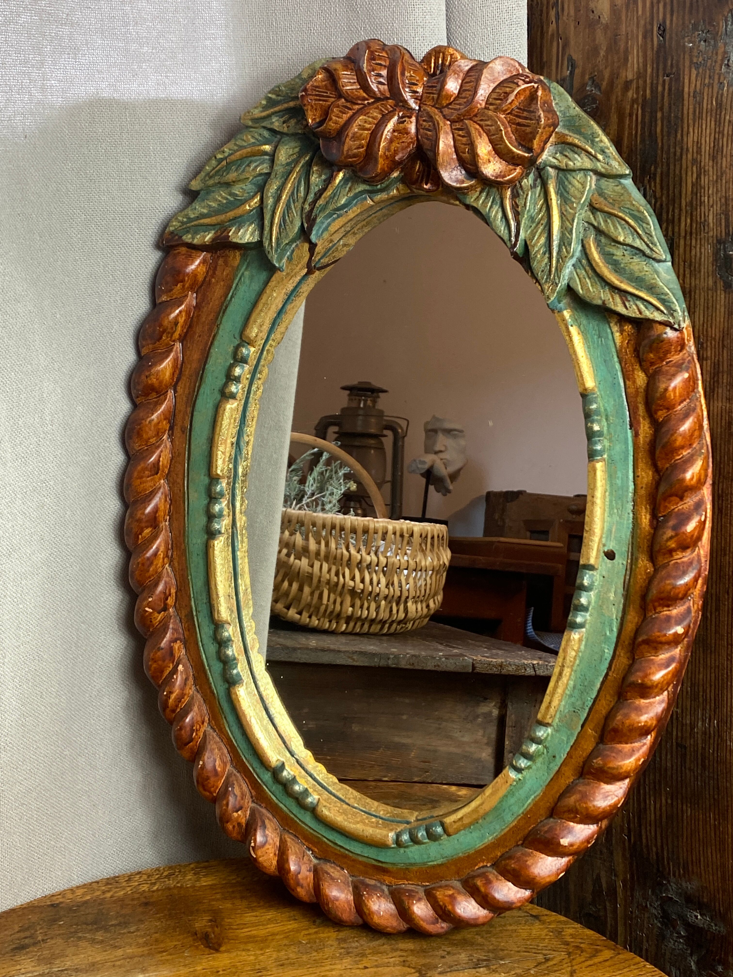 Oval mirror in carved wood