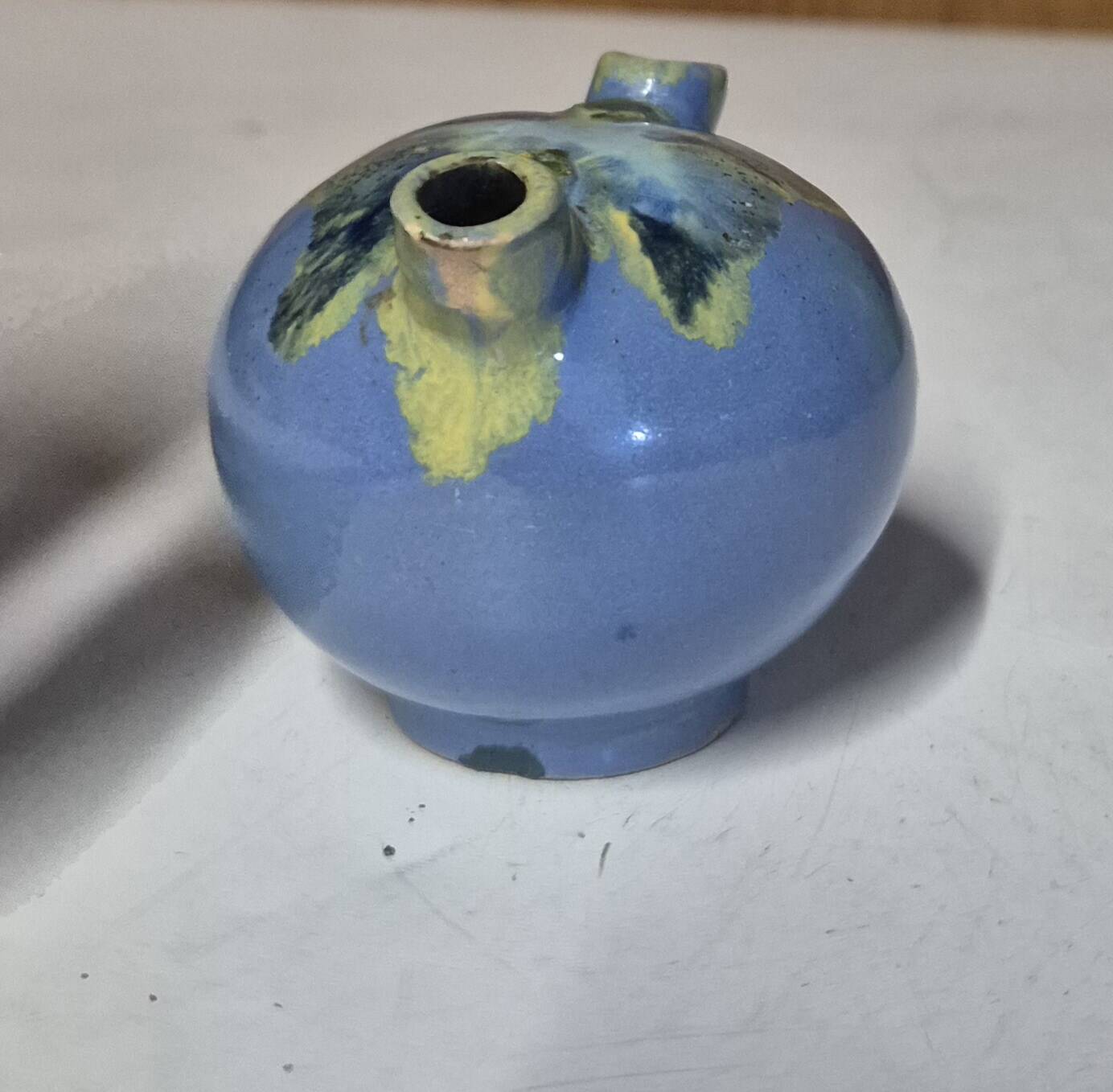 Glazed ceramic flower spike vase stamped "to be defined"