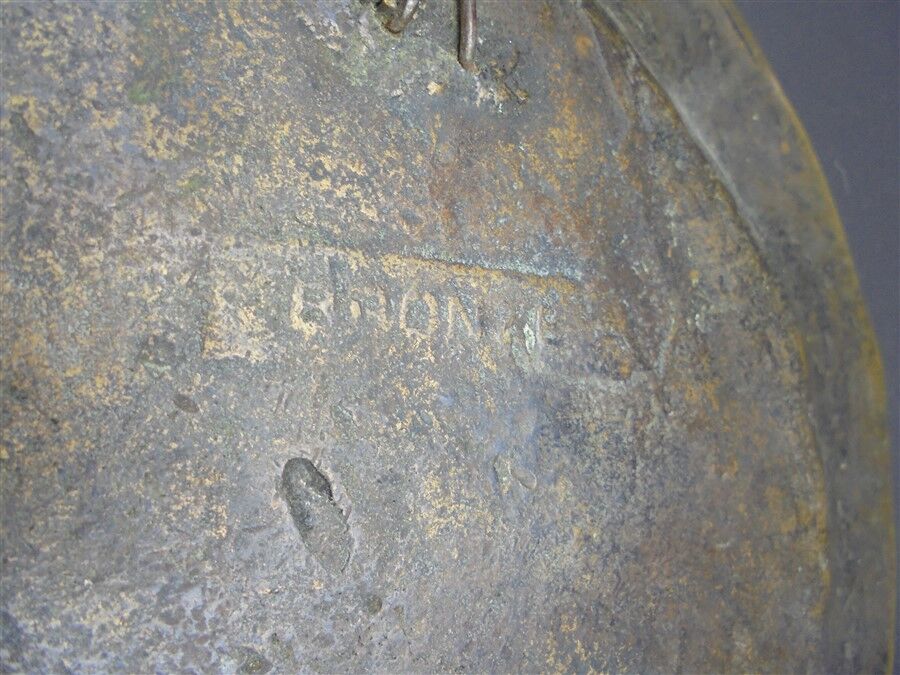 Bronze plate decorated with an eagle