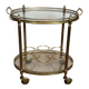 Table roulante ovale en laiton dans le goût de la Maison Jansen. Vers 1940