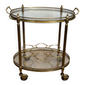 Table roulante ovale en laiton dans le goût de la Maison Jansen. Vers 1940