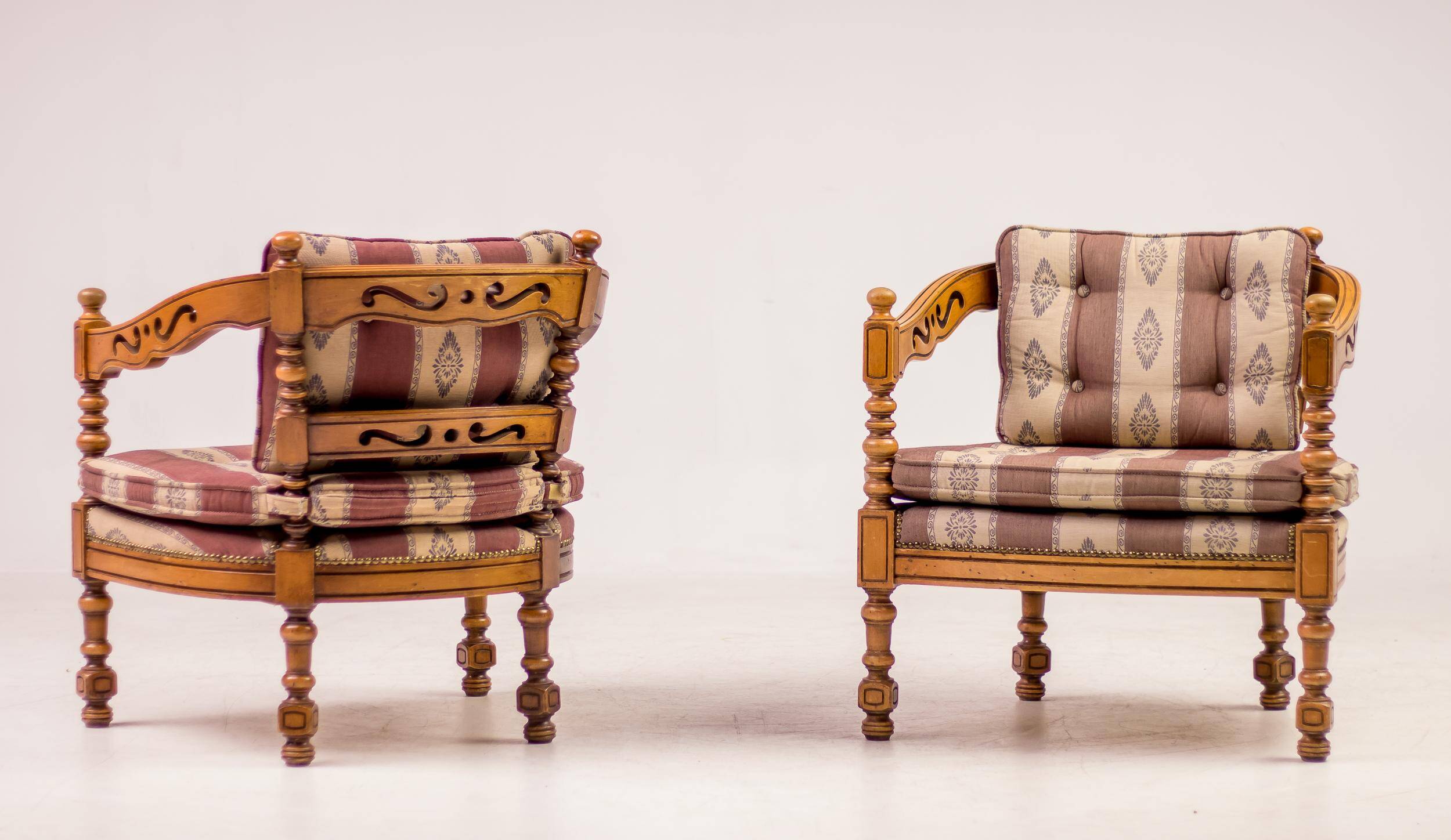 Pair of Giorgetti "1975 Gallery" armchairs in carved wood, original upholstery.