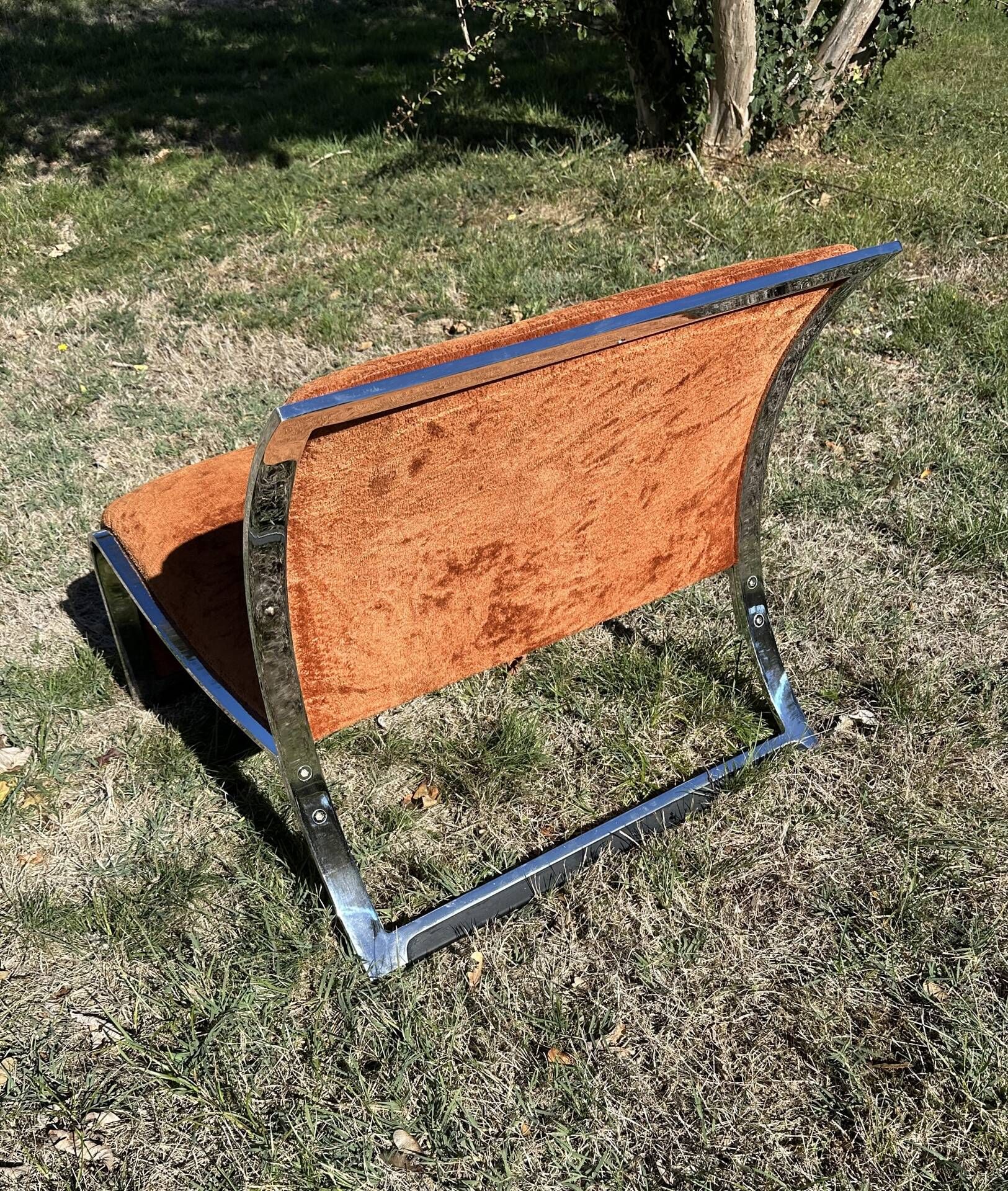 Chrome steel armchair and orange fabric by Vittorio Introini