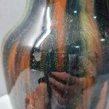 Terracotta vase with a child's head