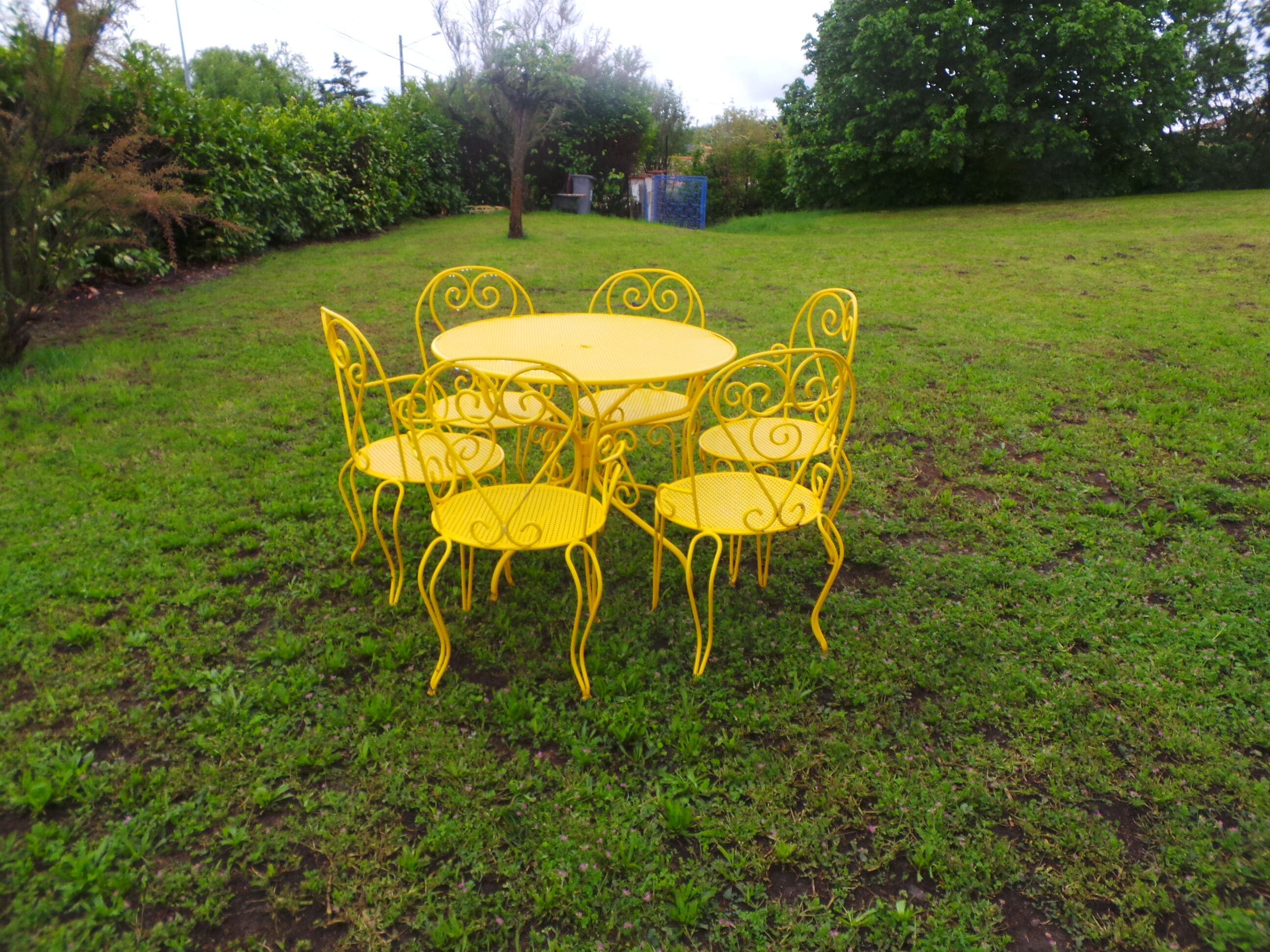 Yellow wrought iron garden room