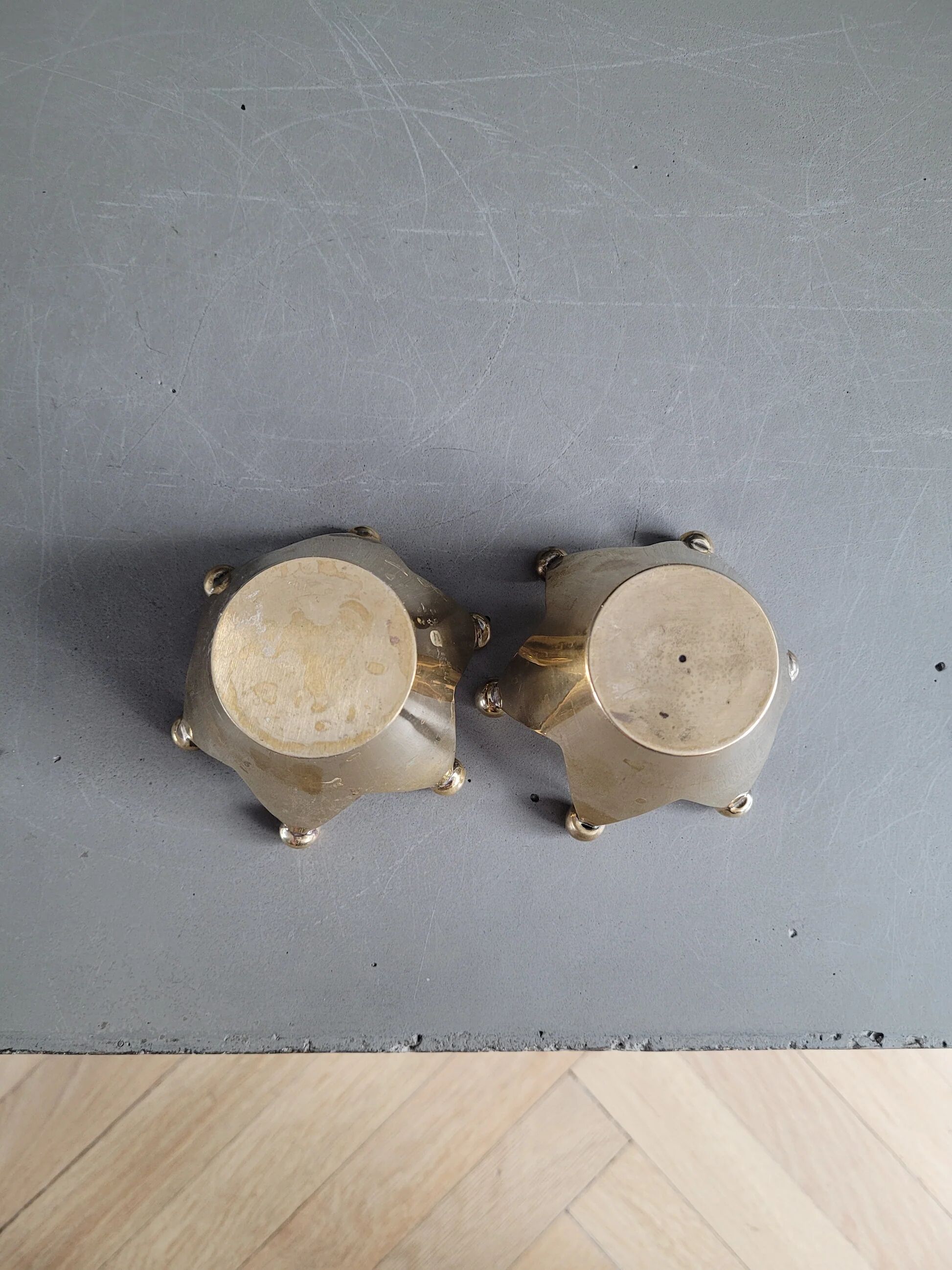 Pair of crown candle holders in brass
