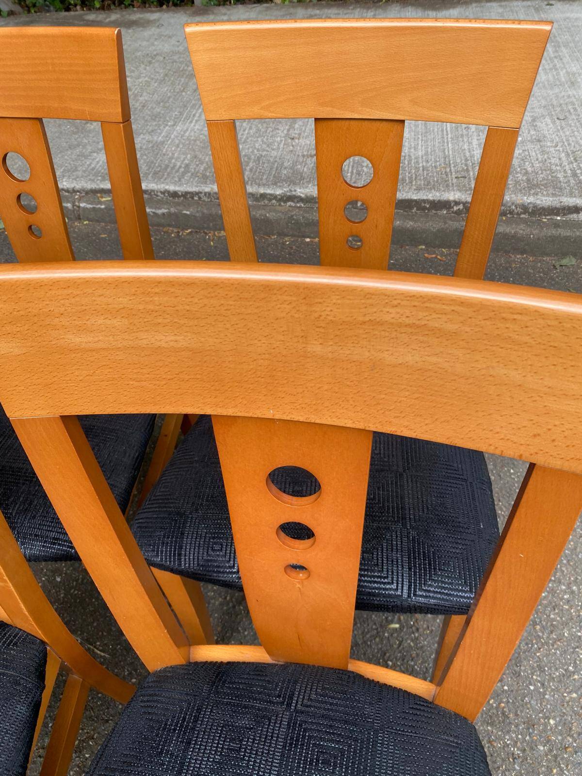 4 Scandinavian dining chairs in solid wood and black fabric from the 1990s.