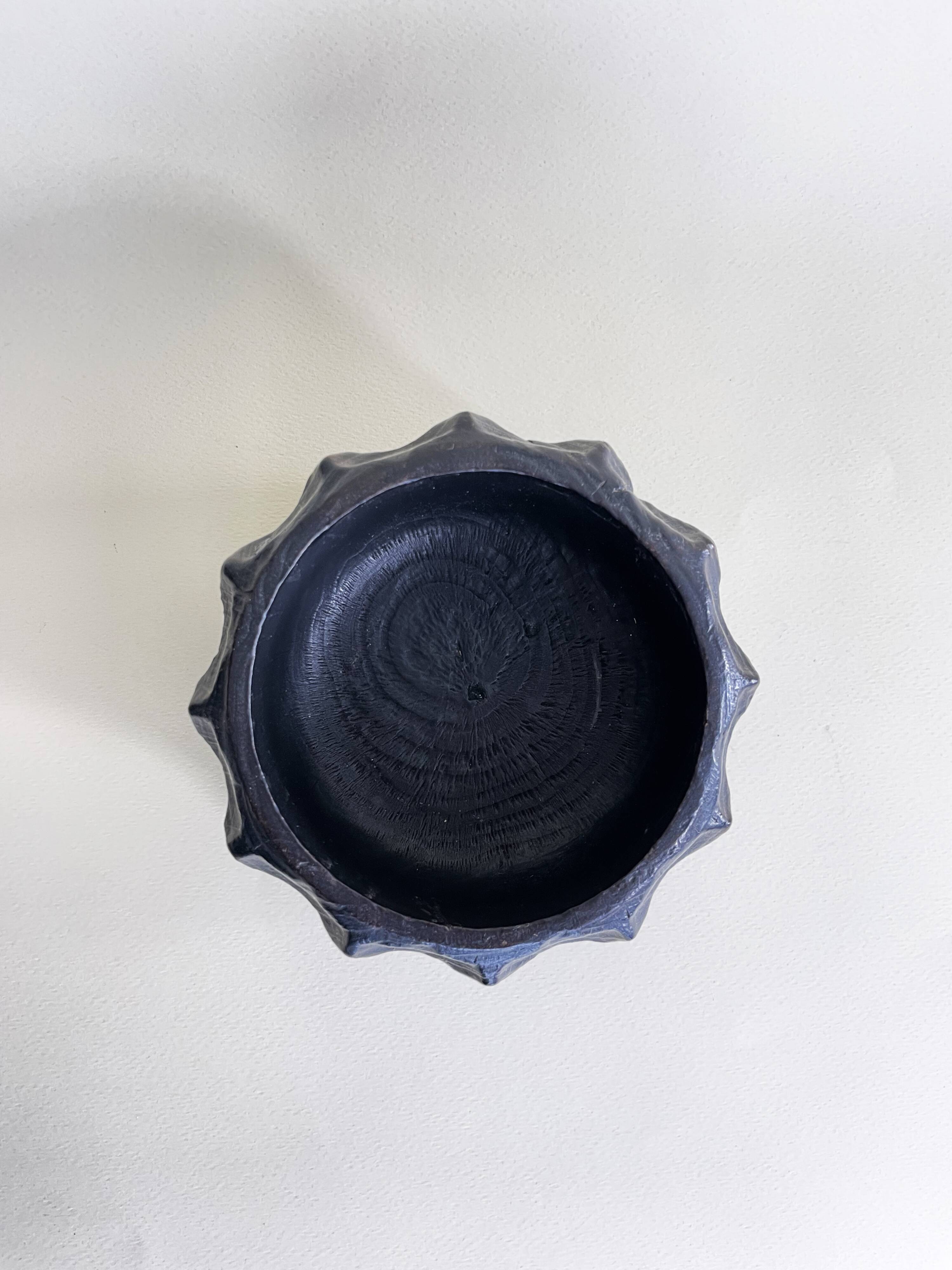 Brutalist wooden pocket emptier