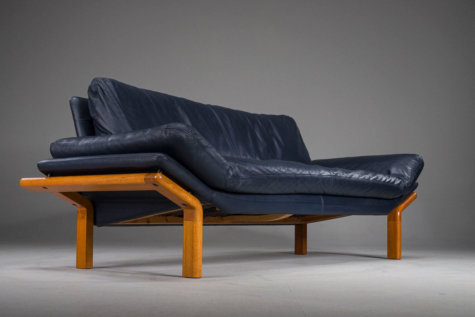 Danish teak and navy blue leather 3-seater sofa from Komfort, 1970s
