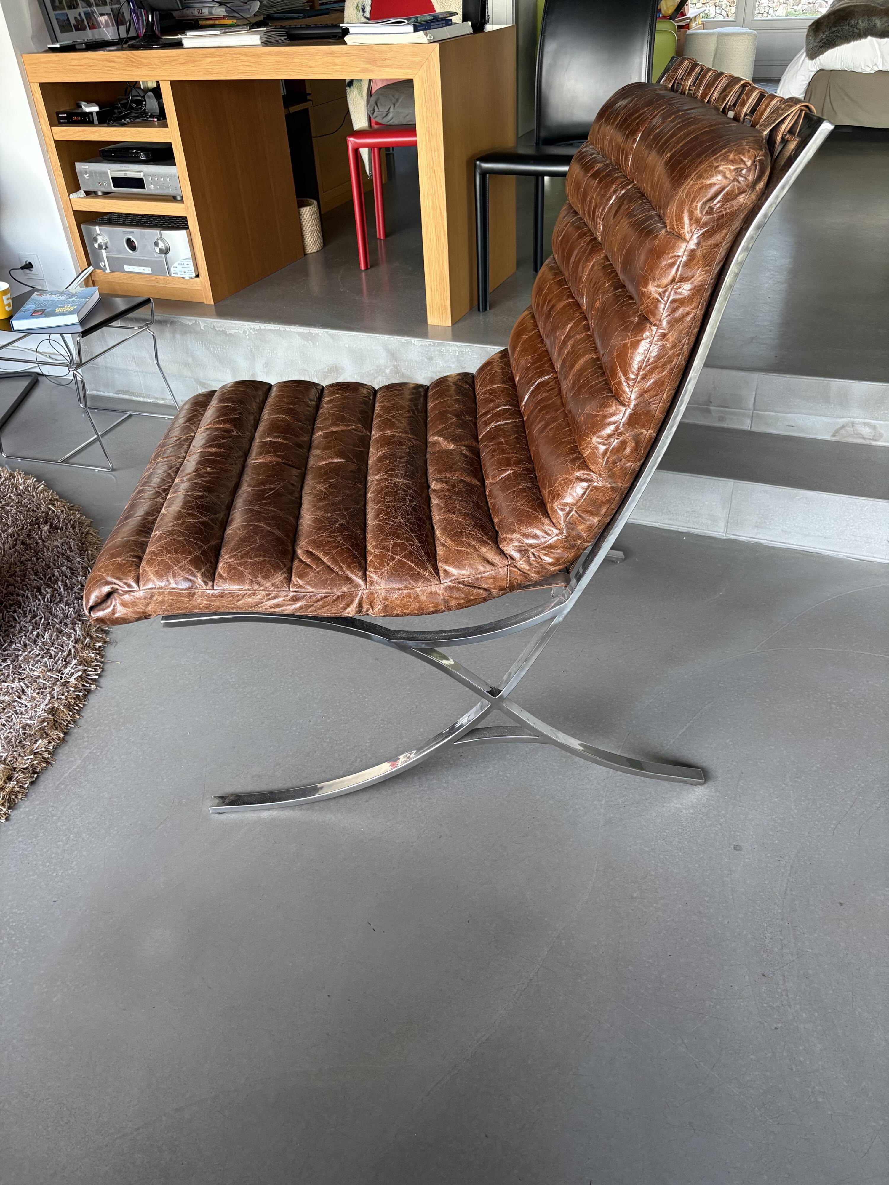 Pair of brown leather armchairs