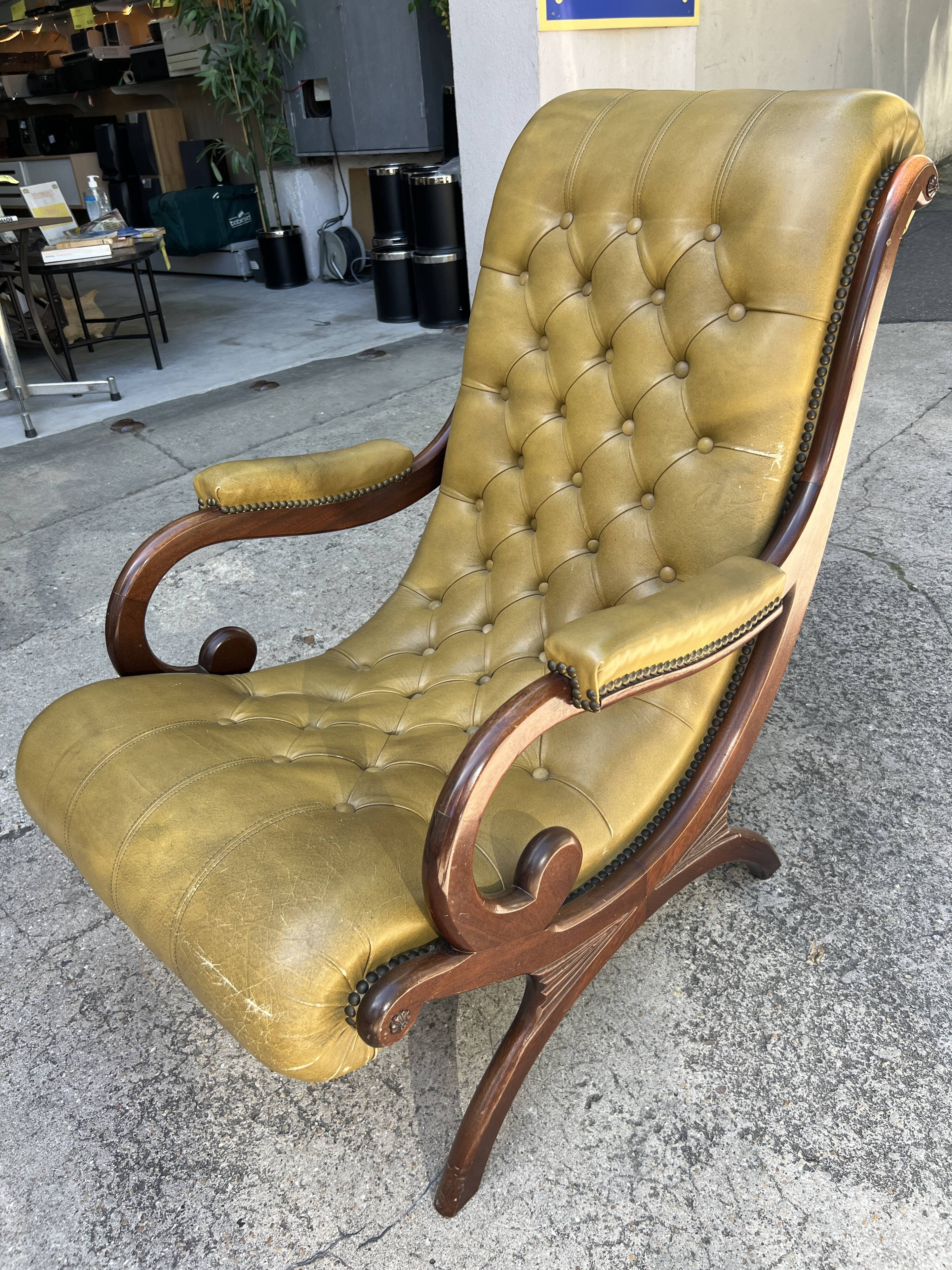 Victoria style green leather chesterfield armchair