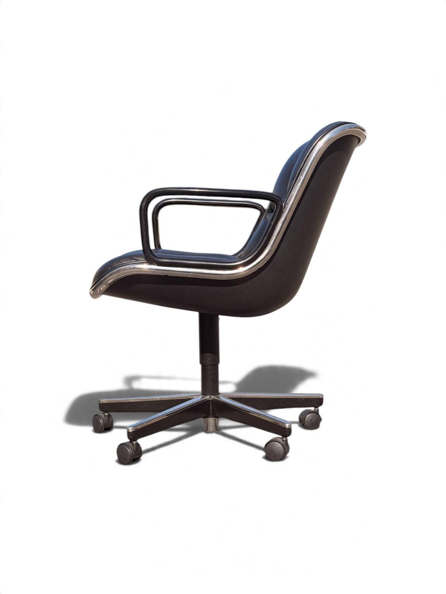 Charles Pollock Executive Knoll office chair in black leather.