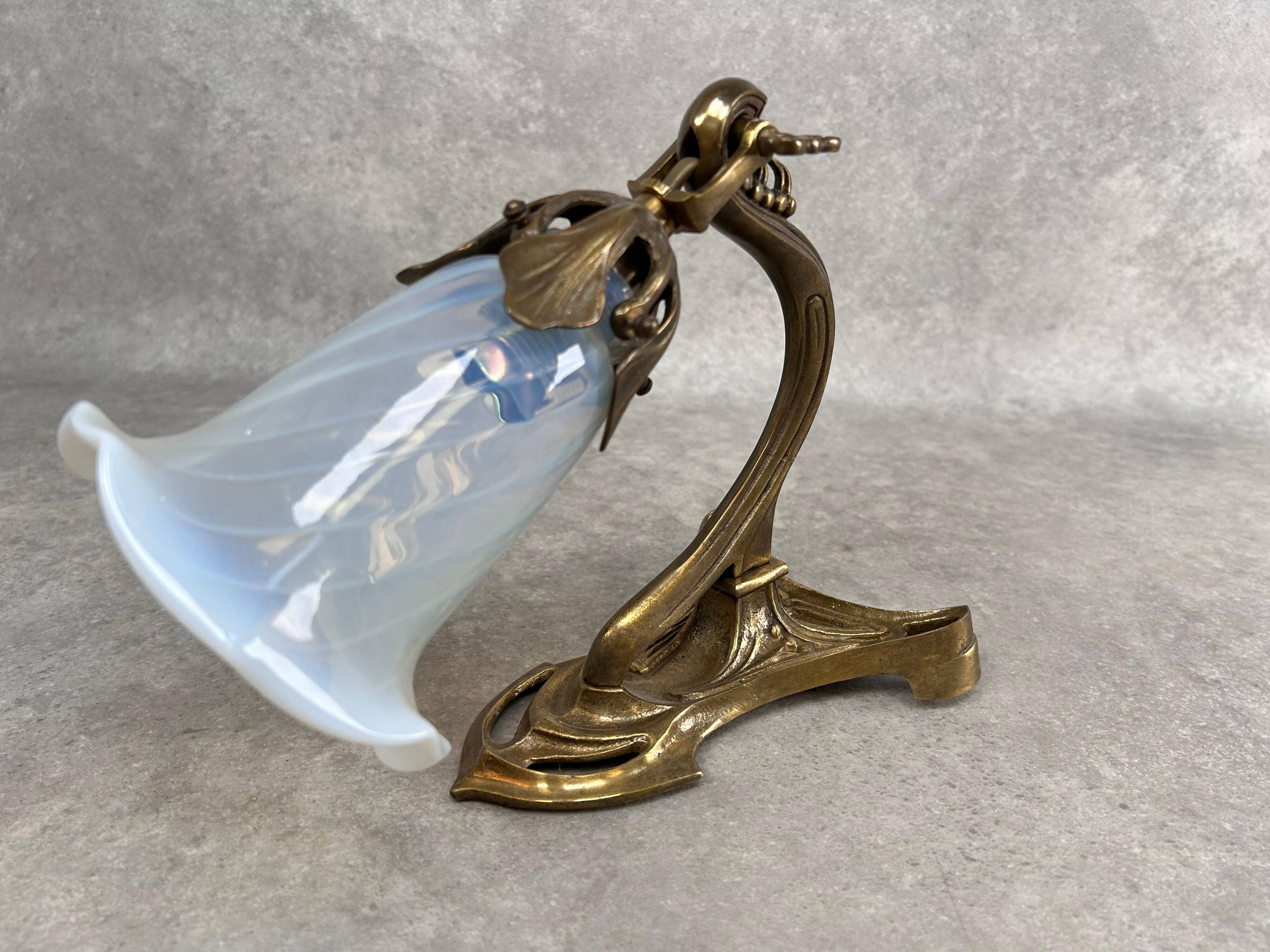 Art Nouveau wall sconces with opalescent iridescent glass