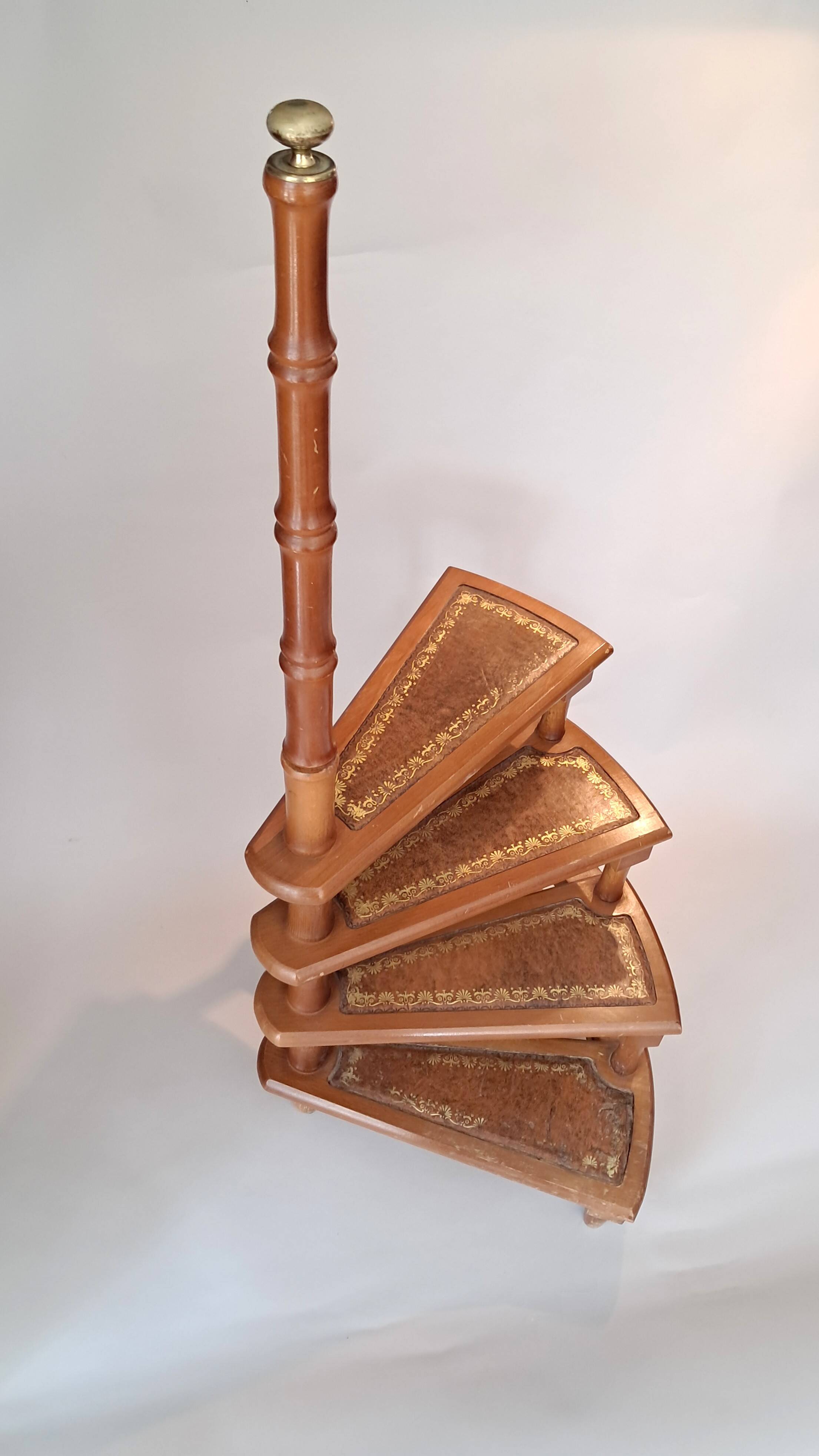 Library spiral staircase in beech and brown leather.
