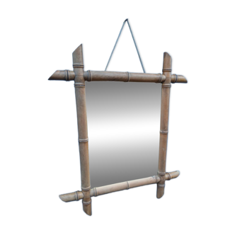 Antique wall mirror with a wooden frame