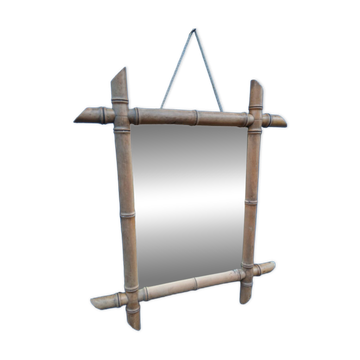 Antique wall mirror with a wooden frame