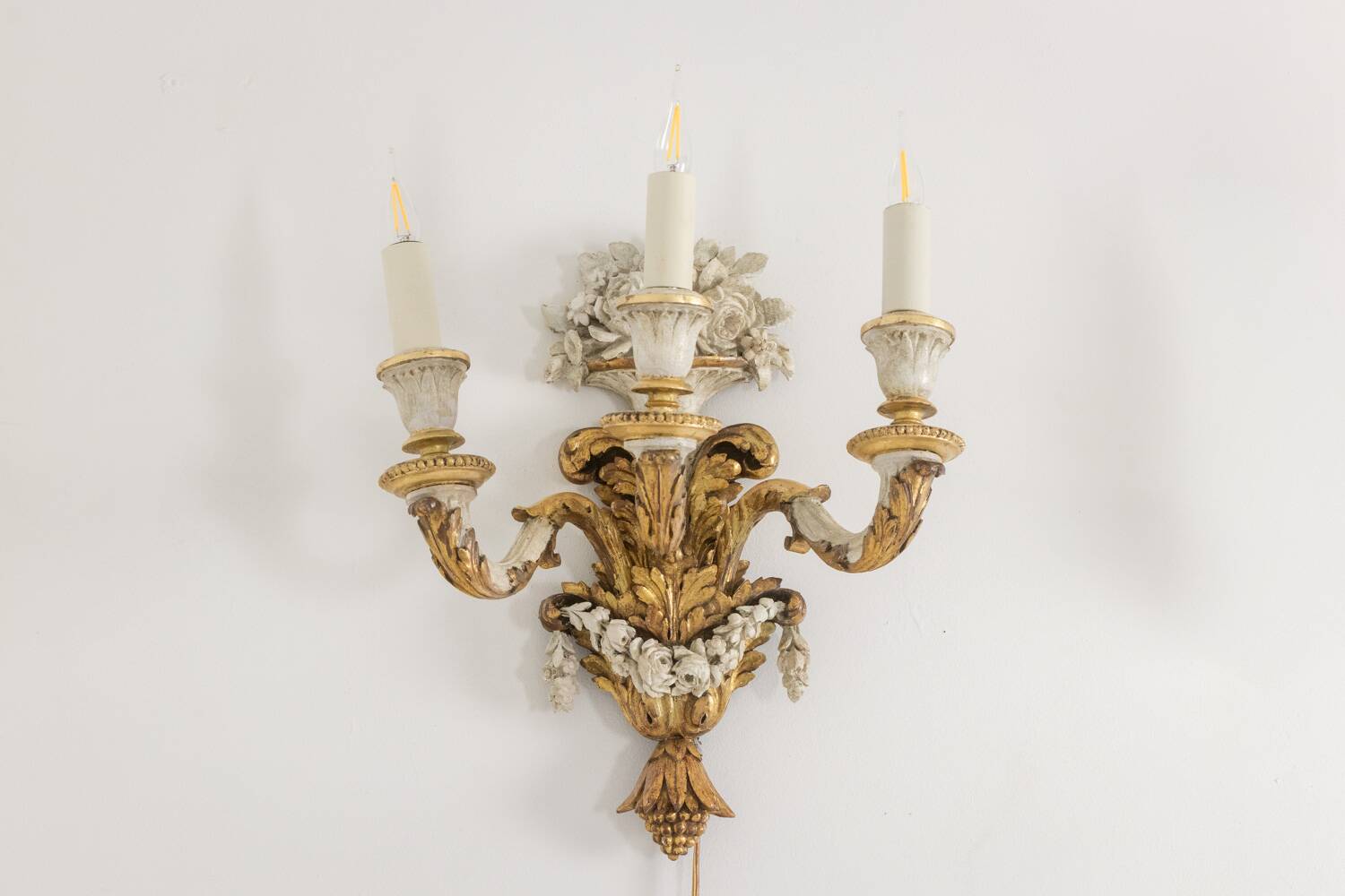 Pair of Louis XVI style wall lights in gilded and lacquered wood. Circa 1900.