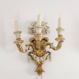 Pair of Louis XVI style wall lights in gilded and lacquered wood. Circa 1900.