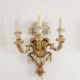 Pair of Louis XVI style wall lights in gilded and lacquered wood. Circa 1900.